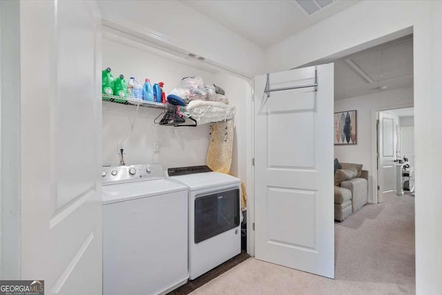 2404 Fitts Dr, Conyers, GA 30094 - laundry room featuring washing machine and clothes dryer, attic access, and light carpet