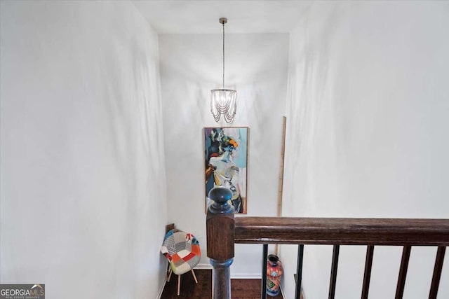 2404 Fitts Dr, Conyers, GA 30094 - hall featuring a chandelier and wood finished floors