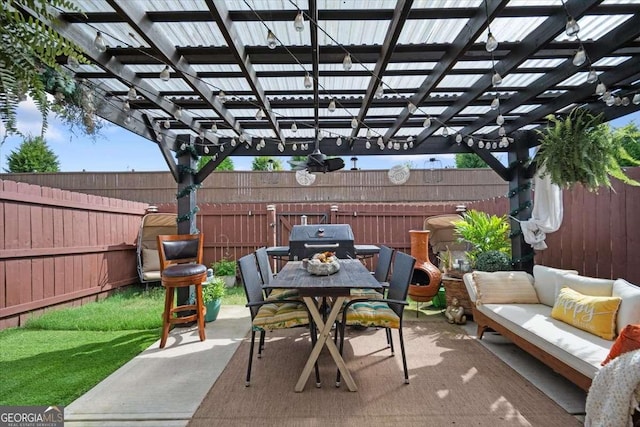 2404 Fitts Dr, Conyers, GA 30094 - fenced backyard with an outdoor living space, a pergola, outdoor dining area, grilling area, and a patio area