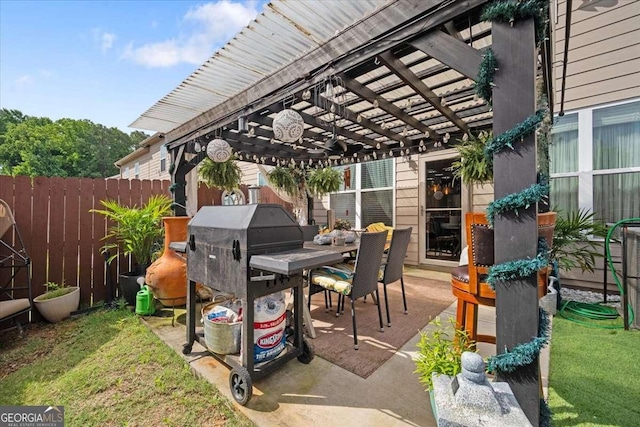 2404 Fitts Dr, Conyers, GA 30094 - view of patio with a pergola, outdoor dining area, and area for grilling