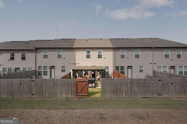 2404 Fitts Dr, Conyers, GA 30094 - rear view of property with a gazebo and a fenced backyard