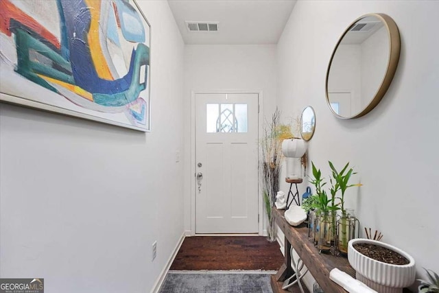 2404 Fitts Dr, Conyers, GA 30094 - doorway featuring wood finished floors and baseboards