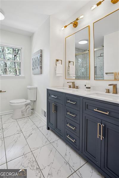 335 Amberidge, Atlanta, GA 30328 - bathroom with double vanity, a stall shower, and marble look tile flooring