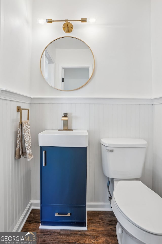 335 Amberidge, Atlanta, GA 30328 - half bathroom with wood finished floors, vanity, and wainscoting