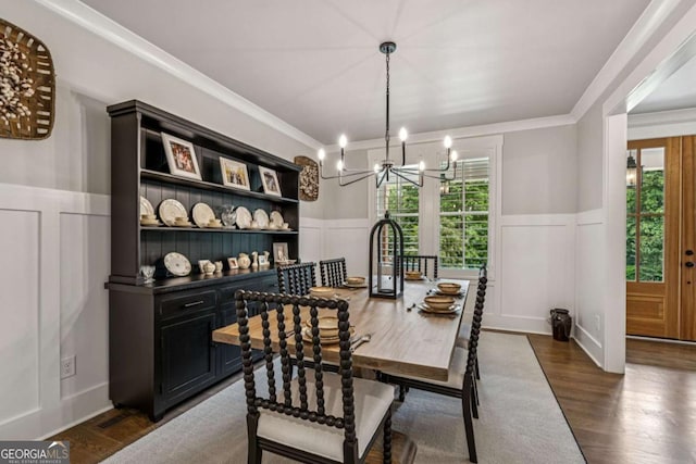 6326 Point Twenty Two, Gainesville, GA 30506 - dining space featuring a decorative wall, a wainscoted wall, a chandelier, healthy amount of natural light, and dark wood-type flooring