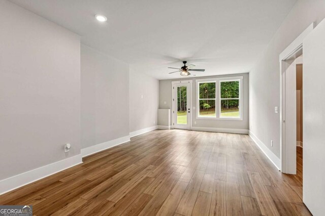 6326 Point Twenty Two, Gainesville, GA 30506 - spare room with ceiling fan, wood finished floors, and recessed lighting