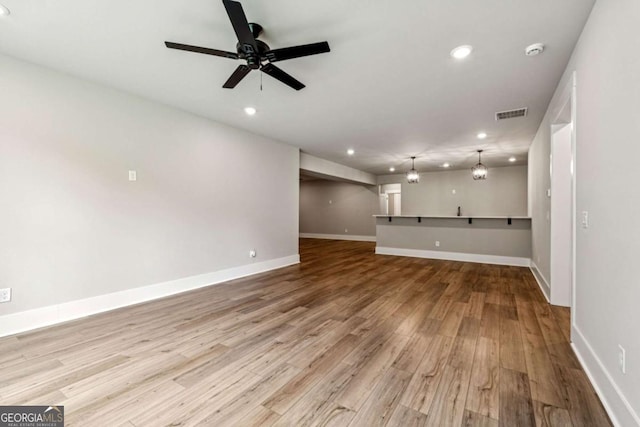 6326 Point Twenty Two, Gainesville, GA 30506 - unfurnished living room featuring recessed lighting, wood finished floors, and ceiling fan