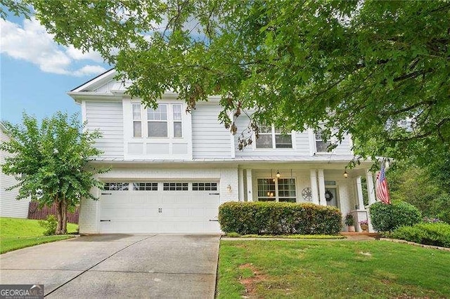 233 Hampton Station Blvd, Canton, GA 30115 - view of front of property featuring driveway, a front yard, a garage, and a porch