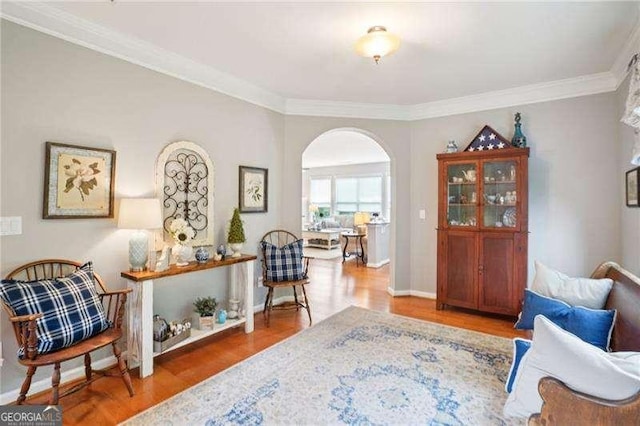 233 Hampton Station Blvd, Canton, GA 30115 - sitting room featuring arched walkways, crown molding, and wood finished floors