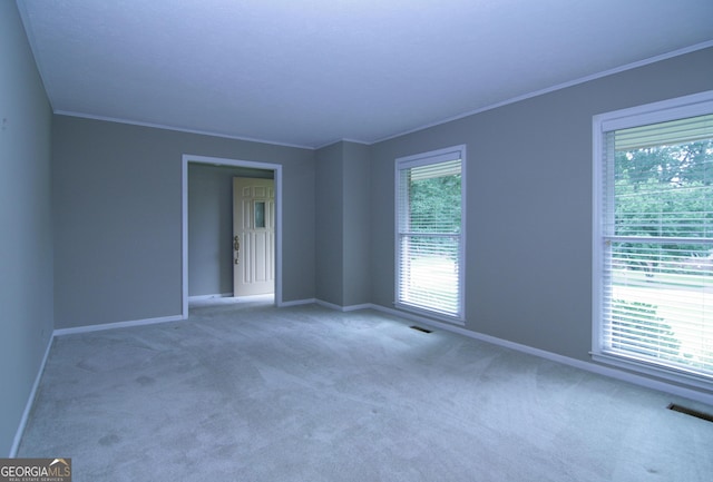 350 Laurel Ln, Lagrange, GA 30241 - carpeted empty room featuring healthy amount of natural light and ornamental molding