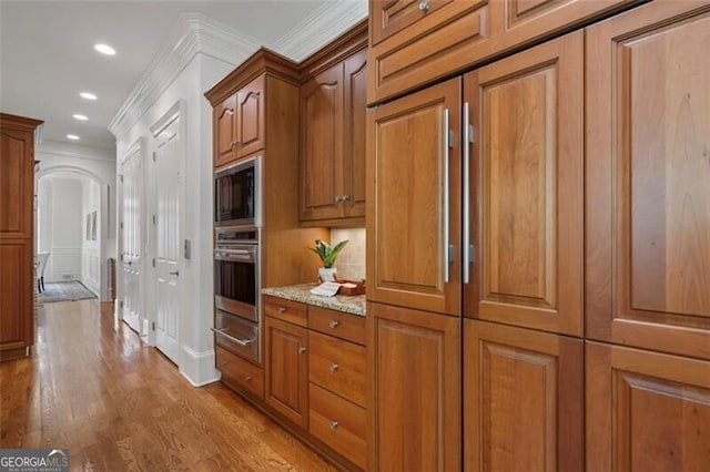 4634 Whitestone Way, Suwanee, GA 30024 - hallway with ornamental molding, light wood-style flooring, recessed lighting, and arched walkways