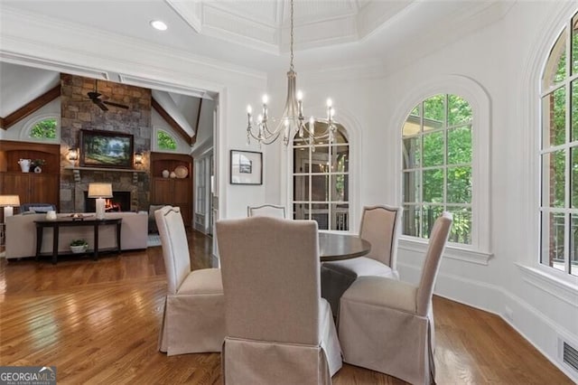 4634 Whitestone Way, Suwanee, GA 30024 - dining space with plenty of natural light, wood finished floors, a chandelier, and ornamental molding