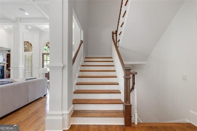 4634 Whitestone Way, Suwanee, GA 30024 - staircase featuring wood finished floors and ornate columns