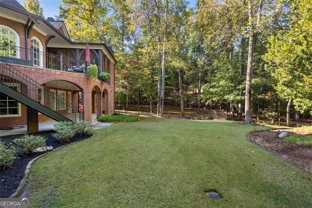 4634 Whitestone Way, Suwanee, GA 30024 - view of grassy yard with a balcony