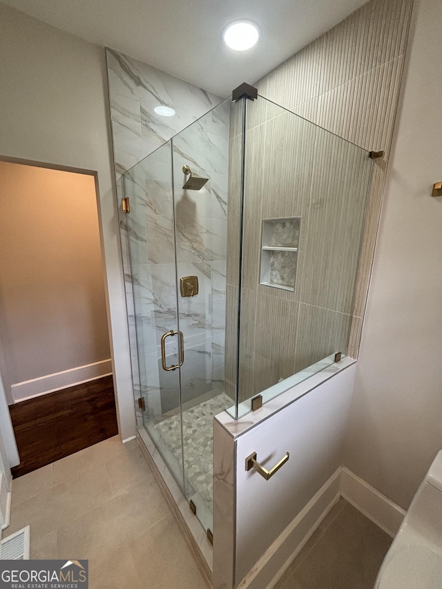 1460 Hartford Ave SW, Atlanta, GA 30310 - full bathroom featuring baseboards and a marble finish shower