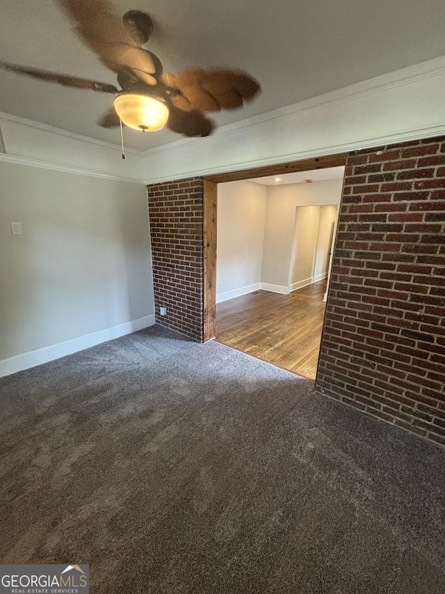 1460 Hartford Ave SW, Atlanta, GA 30310 - empty room with crown molding, brick wall, carpet flooring, and a ceiling fan