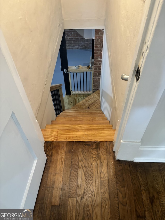 1460 Hartford Ave SW, Atlanta, GA 30310 - stairs featuring wood finished floors and brick wall
