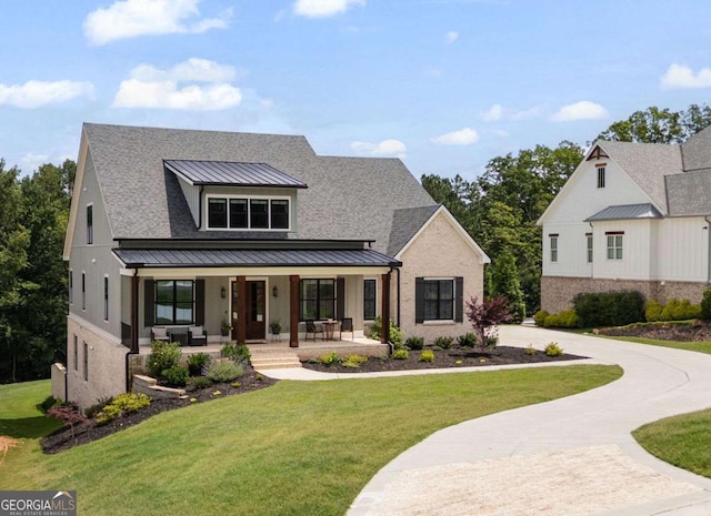 4445 Pebble Rock Dr, Cumming, GA 30041 - modern inspired farmhouse featuring a standing seam roof, a porch, a front lawn, a shingled roof, and a metal roof