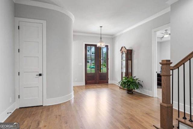 4445 Pebble Rock Dr, Cumming, GA 30041 - entryway with stairs, wood finished floors, french doors, crown molding, and a ceiling fan