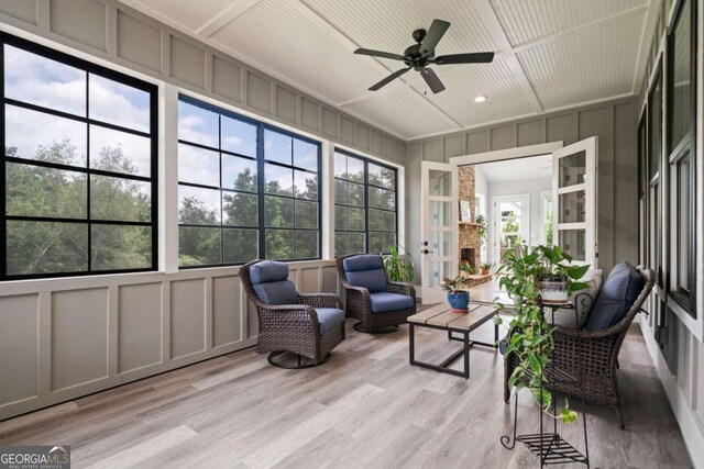 4445 Pebble Rock Dr, Cumming, GA 30041 - sunroom with a decorative wall, ceiling fan, and wood finished floors