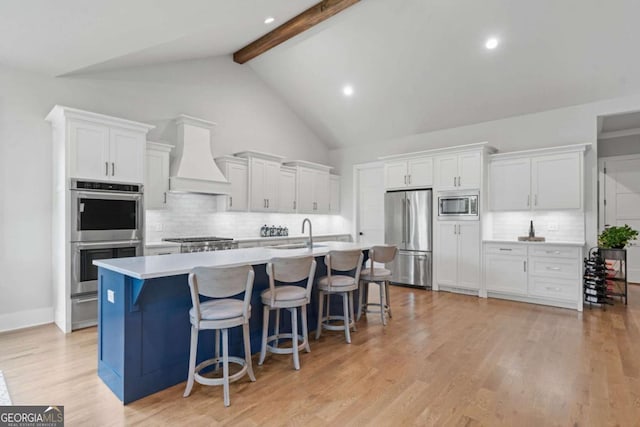 4445 Pebble Rock Dr, Cumming, GA 30041 - kitchen with stainless steel appliances, custom exhaust hood, decorative backsplash, beam ceiling, and white cabinetry