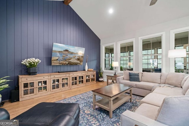 4445 Pebble Rock Dr, Cumming, GA 30041 - living room featuring wood finished floors, vaulted ceiling, and ceiling fan