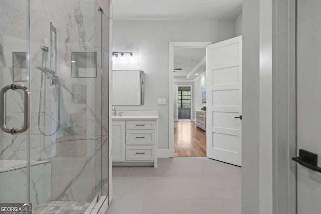 4445 Pebble Rock Dr, Cumming, GA 30041 - bathroom featuring a marble finish shower, vanity, connected bathroom, and tile patterned flooring