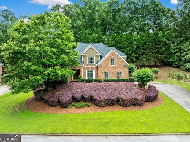 205 Camden Creek Ct, Lawrenceville, GA 30043 - view of front of house featuring a front yard and brick siding