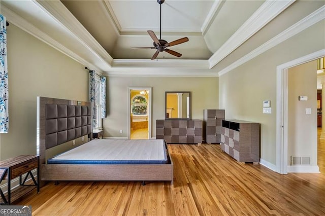 205 Camden Creek Ct, Lawrenceville, GA 30043 - bedroom featuring a raised ceiling, ornamental molding, wood finished floors, and a ceiling fan