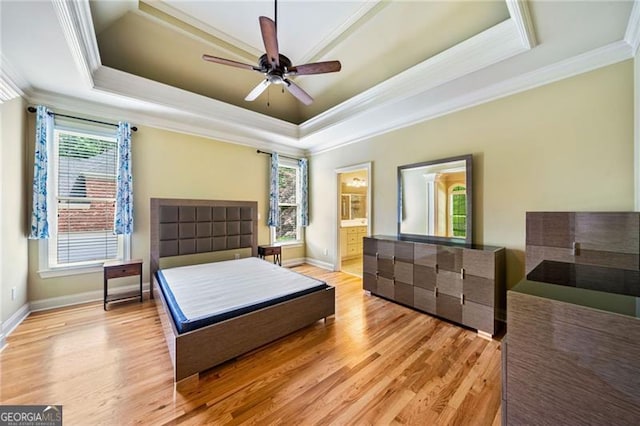 205 Camden Creek Ct, Lawrenceville, GA 30043 - bedroom with ornamental molding, a tray ceiling, multiple windows, light wood-style flooring, and ensuite bath