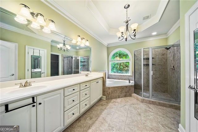 205 Camden Creek Ct, Lawrenceville, GA 30043 - full bath featuring a chandelier, double vanity, a bath, a shower stall, and ornamental molding