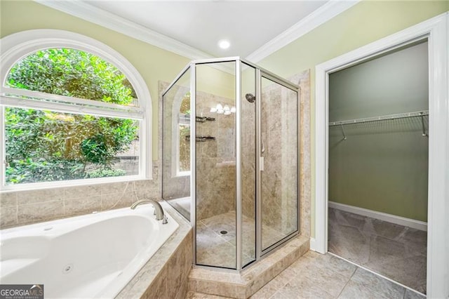 205 Camden Creek Ct, Lawrenceville, GA 30043 - bathroom featuring crown molding, a tub with jets, a stall shower, a walk in closet, and tile patterned flooring