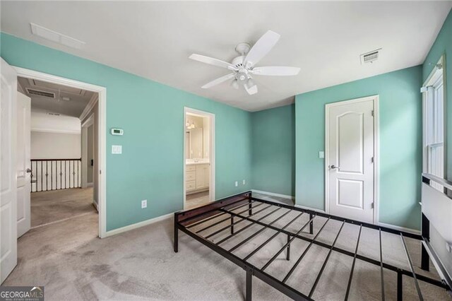 205 Camden Creek Ct, Lawrenceville, GA 30043 - unfurnished bedroom with attic access, carpet, and a ceiling fan