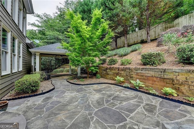 205 Camden Creek Ct, Lawrenceville, GA 30043 - fenced backyard with a patio and a gazebo