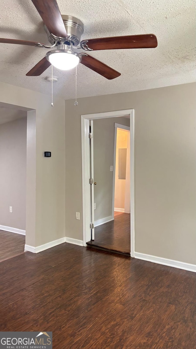 6197 Union Grove Rd, Lithia Springs, GA 30122 - spare room with a ceiling fan, wood finished floors, and a textured ceiling