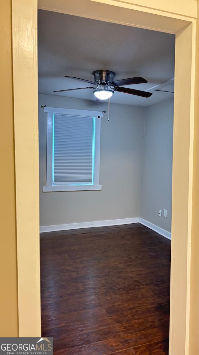 6197 Union Grove Rd, Lithia Springs, GA 30122 - unfurnished room featuring dark wood-type flooring and ceiling fan