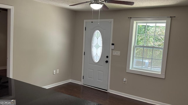 6197 Union Grove Rd, Lithia Springs, GA 30122 - entryway featuring ceiling fan, a textured ceiling, and dark wood-style flooring