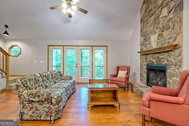 215 Souther Meadow Dr, Blairsville, GA 30512 - living room with plenty of natural light, a ceiling fan, a fireplace, stairs, and vaulted ceiling