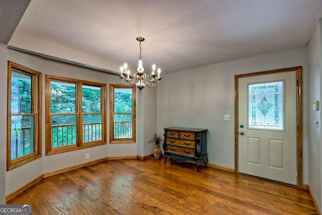 215 Souther Meadow Dr, Blairsville, GA 30512 - entrance foyer with a chandelier, healthy amount of natural light, and light wood-style flooring