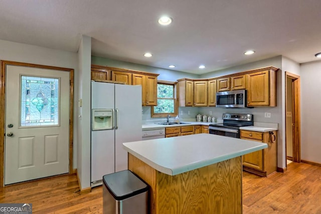 215 Souther Meadow Dr, Blairsville, GA 30512 - kitchen with stainless steel appliances, light countertops, light wood-style flooring, a center island, and recessed lighting