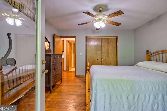 215 Souther Meadow Dr, Blairsville, GA 30512 - bedroom with light wood-style floors, ceiling fan, and a closet