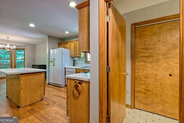 215 Souther Meadow Dr, Blairsville, GA 30512 - kitchen featuring white refrigerator with ice dispenser, light countertops, a chandelier, recessed lighting, and a kitchen island