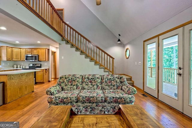 215 Souther Meadow Dr, Blairsville, GA 30512 - living room featuring high vaulted ceiling, stairs, recessed lighting, and light wood-style floors