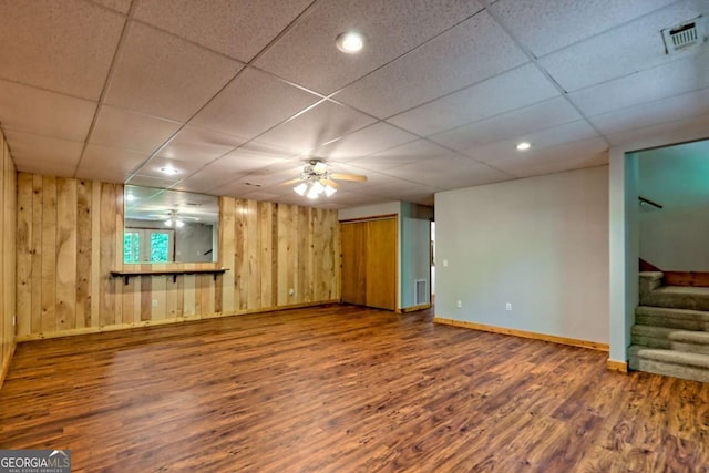 215 Souther Meadow Dr, Blairsville, GA 30512 - spare room with wood finished floors, stairway, wooden walls, a drop ceiling, and ceiling fan