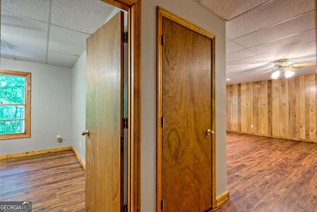 215 Souther Meadow Dr, Blairsville, GA 30512 - hallway featuring a paneled ceiling, wood finished floors, and wooden walls