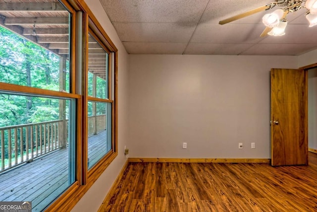 215 Souther Meadow Dr, Blairsville, GA 30512 - spare room featuring wood finished floors, a ceiling fan, and a paneled ceiling