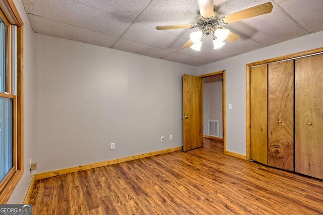 215 Souther Meadow Dr, Blairsville, GA 30512 - unfurnished bedroom with wood finished floors, a closet, and ceiling fan
