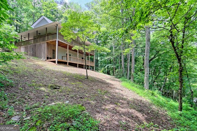 215 Souther Meadow Dr, Blairsville, GA 30512 - back of house featuring a wooden deck and a wooded view