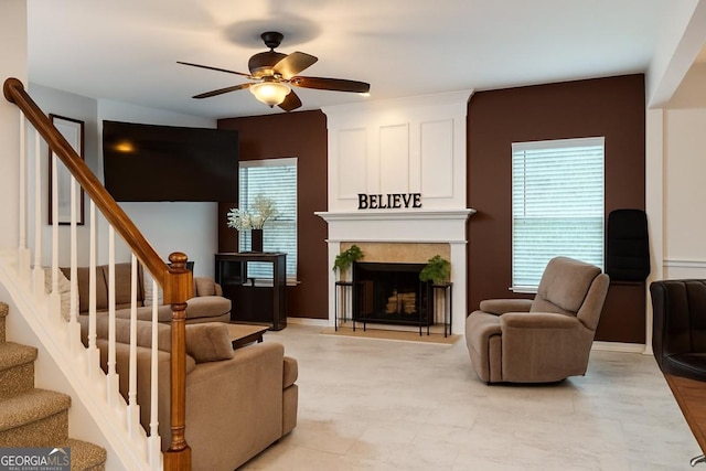 3439 Tupelo Trl, Auburn, GA 30011 - living area with a ceiling fan, stairway, and a tile fireplace