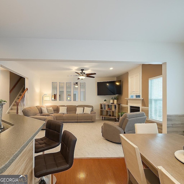 3439 Tupelo Trl, Auburn, GA 30011 - living room featuring stairway, wood finished floors, ceiling fan, and recessed lighting